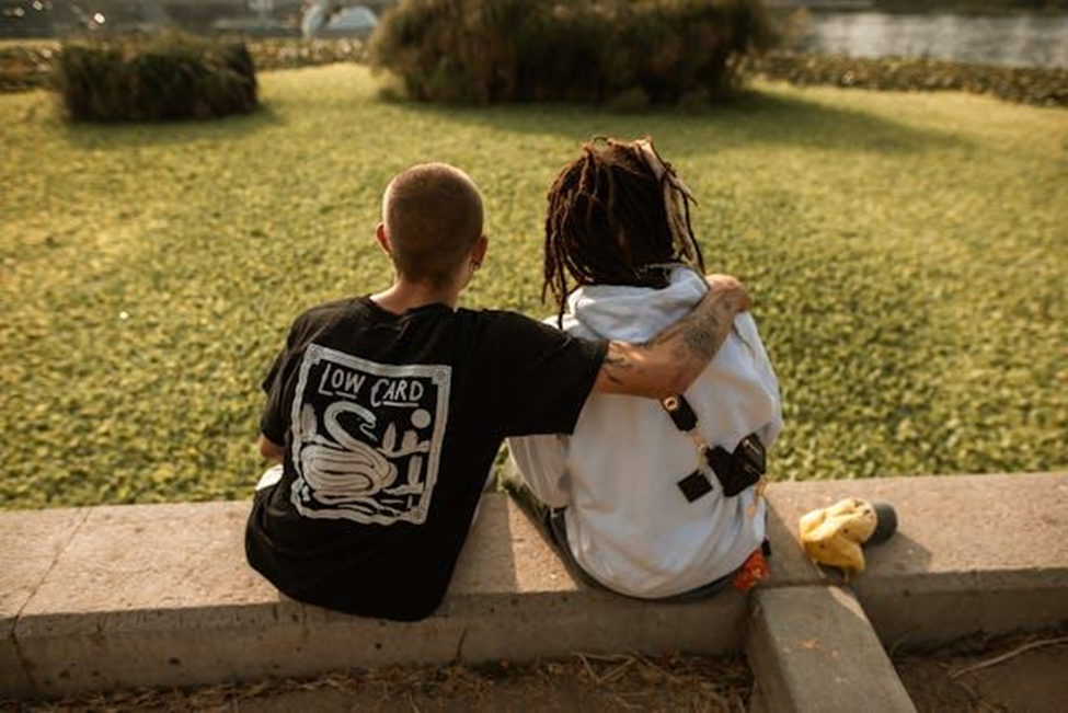 Two friends sitting in a park