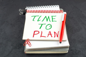 Notebook with “time to plan” written on the first page.
