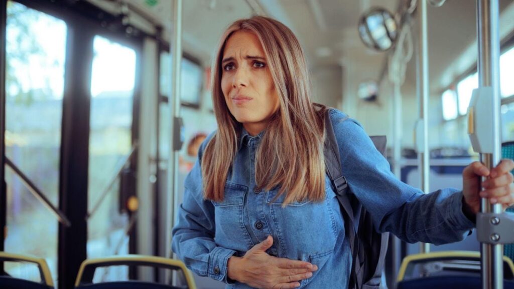 A passenger is experiencing nausea due to motion sickness.