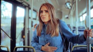 A passenger is experiencing nausea due to motion sickness.
